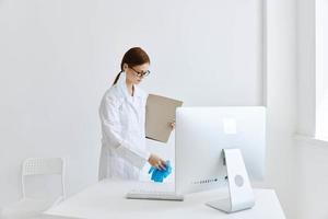 nurse in white coat holding folder hospital assistant work photo