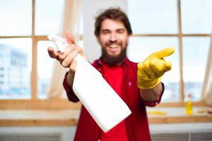 Cheerful male cleaning professional household cleaning service photo