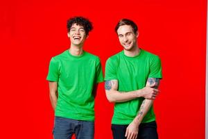 two friends green t-shirts fashion casual clothing studio photo