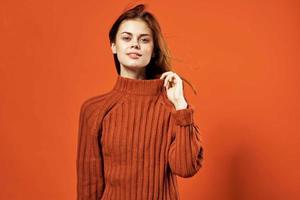 woman in red sweater clean skin hairstyle fashion studio photo