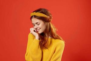 cheerful woman in yellow sweater hipster clothes studio fashion lifestyle photo