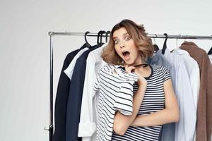 pretty woman trying on clothes isolated background photo