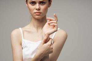 disgruntled woman arm pain arthritis chronic disease isolated background photo