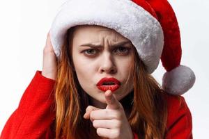 woman in santa hat red lips emotions posing holiday photo