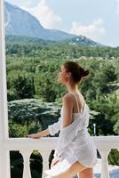 Portrait of a beautiful woman Sexy carefree model posing at the balcony Lifestyle photo