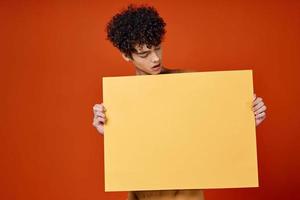 guy holding a banner isolated background studio copy-space photo