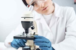 Woman in white coat science research experiment professional photo