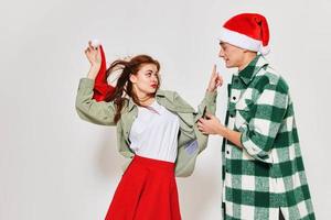 Cheerful young couple wearing New Year's clothes emotions Friendship holiday relationship Christmas photo