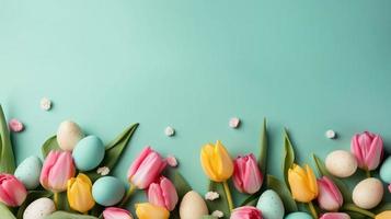 Top View of Happy Easter card background with tulips and decorative eggs in various colors photo