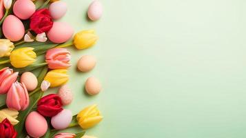 Happy easter holiday celebration background with tulips and decorative eggs in various colors photo