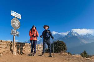 A young traveller trekking in Poon Hill view point in Ghorepani, Nepal photo