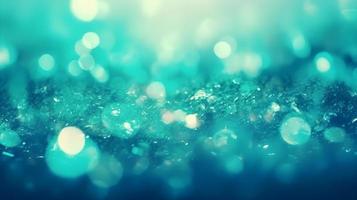 Blue Green Teal Bokeh Lights with Snow Texture for Christmas and Winter Holidays photo