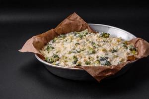 Delicious quiche with broccoli, cheese, chicken, spices and herbs photo