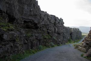 Walking path between tectonic plates at Thingvellir National Park, Iceland photo
