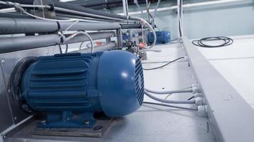 Induction motor instaled on incubation machine hatchery technology to moving the fan. photo