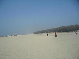 Photo of natural landscape view of a beautiful winter beach and sea on a sunny day in Cox's Bazar, Bangladesh. Travel and Vacation.