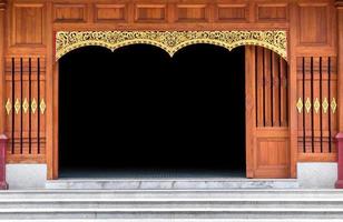 carved wooden door in thai temple. decoration of wood pattern photo