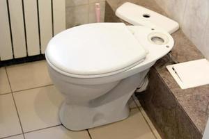 Toilet bowl in a home toilet, closeup photo. photo