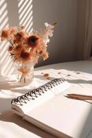 Blank notepad with dry flowers. Illustration photo