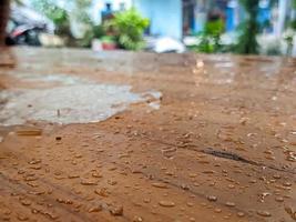 A close up of a wet brown table photo