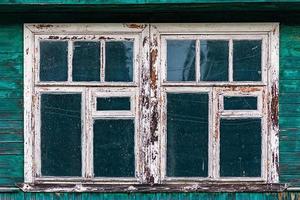 windows of old shabby wooden house photo