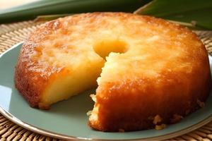 A Brazilian cake Bolo de Macaxeira with a slice taken out photo