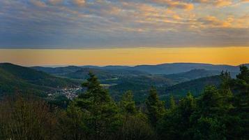 Aerial view over the forest during sunset photo