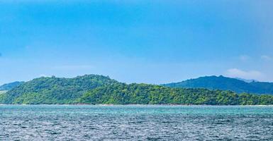 Tropical paradise turquoise water beach  limestone rocks Phuket island Thailand. photo