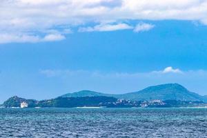 Tropical paradise turquoise water beach  limestone rocks Phuket island Thailand. photo