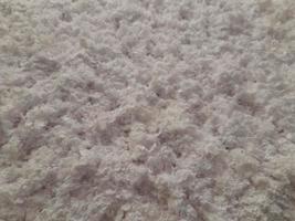 Fluffy surface. Flake surface. Fluffy cereal background photo