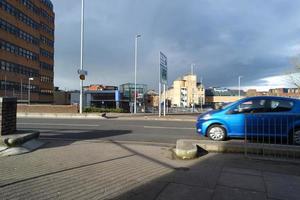 Low Angle View of British Road and Traffic at Luton Town of England UK. The Image Was Captured at Central Luton  City During a Cold and Cloudy Evening of 24-March-2023 photo