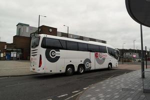 Low Angle View of Luton Central Bus Station at Main Railway Station of Downtown Luton City of England Great Britain. The Image Was Captured on 01-April-2023 on Cloudy and Cold Evening photo