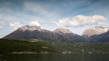 timelapse of annecy lake in the french alps with mountains in the background video