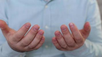 Young muslim praying and rubbing their hands on their faces in the masjid, view of a man reciting verse in the mosque, the man who says amen rubs his hand on his face video