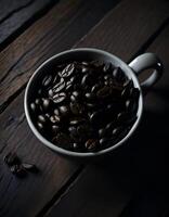 Coffe beans in a white cup on wooden table. . photo