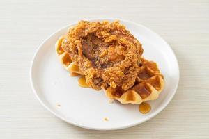 fried chicken waffle with honey or maple syrup photo