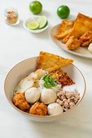 spicy small flat rice noodles with fish balls and shrimp balls without soup photo