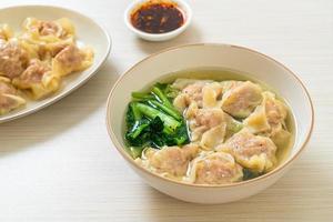 pork wonton soup or pork dumplings soup with vegetable photo