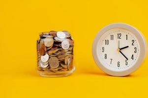 coin in glass jar saving money in a glass jar saving money concept salary income wages photo