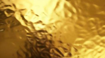 Gold foil metallic wrapping paper texture background photo