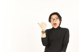 Presenting and Pointing Side Product Using Thumb Of Handsome Asian Man Isolated On White Background photo
