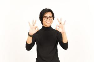 Showing OK Sign Of Handsome Asian Man Isolated On White Background photo
