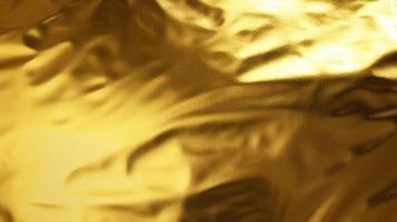 Gold foil metallic wrapping paper texture background photo