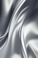 Silver silk wavy fabric background photo