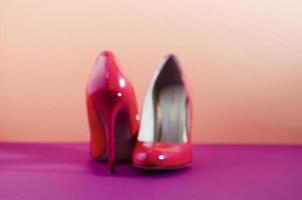 Soft focus blurred picture. Blurred background. Elegant classic shoes close-up. Bright pink high heeled shoes. photo