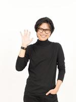 Hi Greeting or Waving at Camera Of Handsome Asian Man Isolated On White Background photo