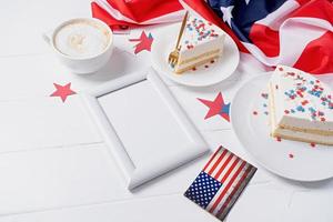 Sweet cake with usa flag colored sprinkles and stars and blank frame for mockup photo