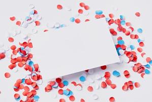 business card mockup on colorful circle confetti, decorations for fourth july photo