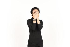 Shocked Covering Face and Peep Between the fingers Of Handsome Asian Man Isolated On White photo