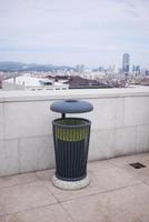 Bag with garbage and rubbish bin photo